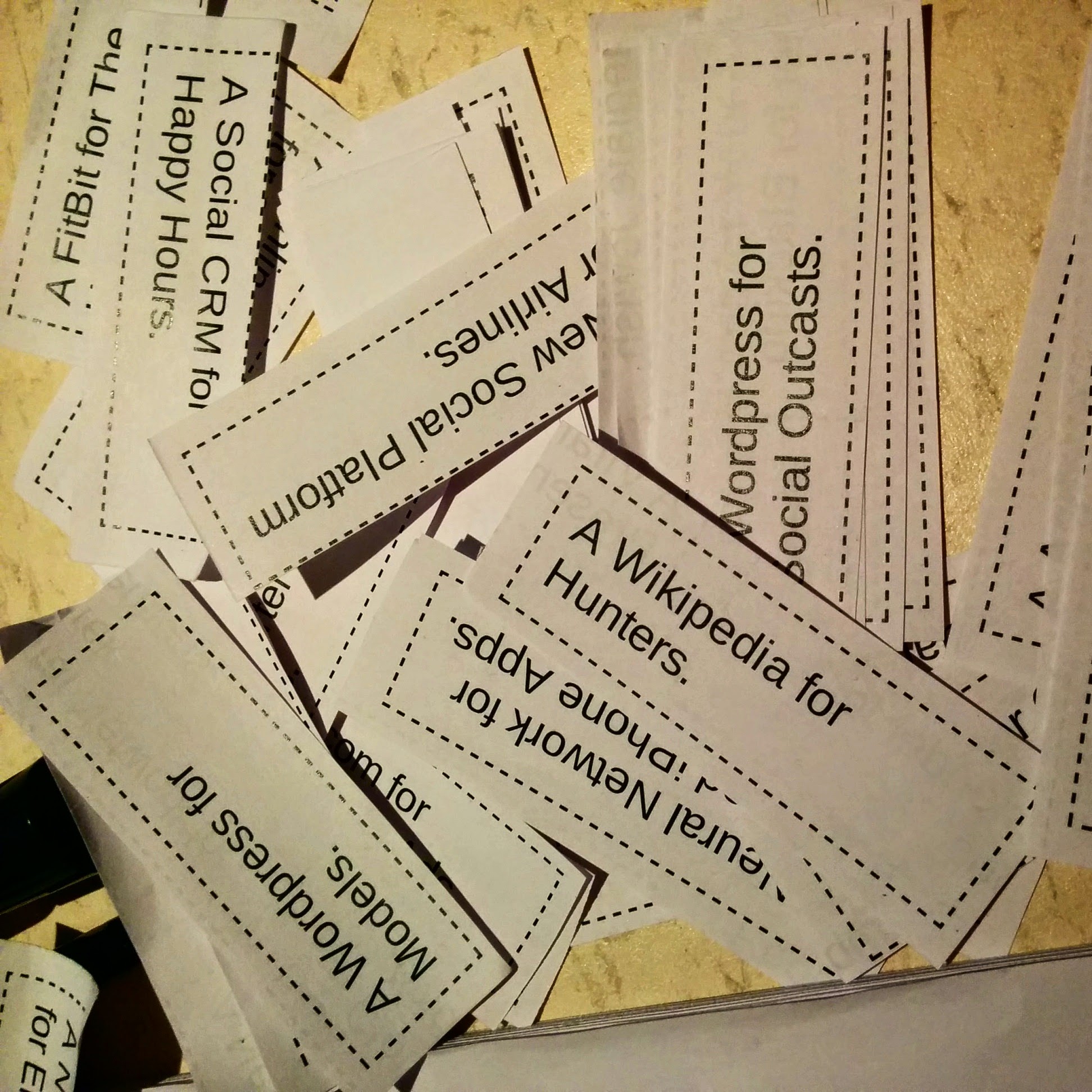 small pieces of paper with some silly things written on them, like "Wikipedia for hunters"