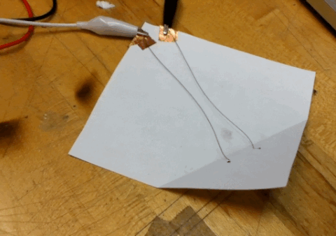 Shape memory alloy actuator folds paper